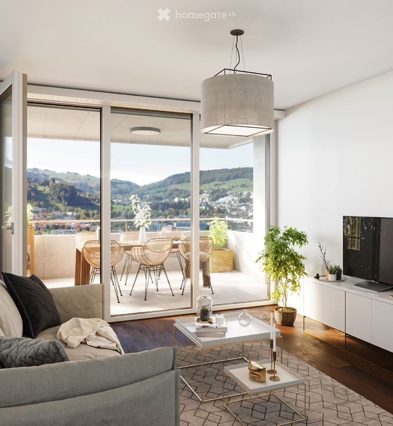 Modern living room with large windows offering a scenic view, a sofa, coffee table, side table, television, floor lamp, and a balcony area with chairs and a table.