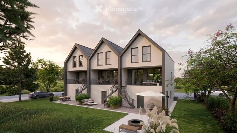Modern two-story house with a raised ground floor, large windows, and a spacious outdoor area with seating and a fire pit.