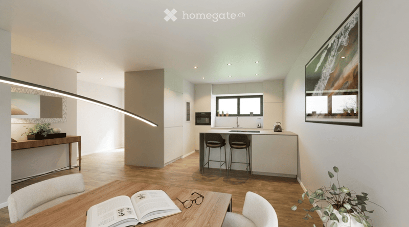 Modern open-plan living and dining area with a kitchen, featuring a wooden dining table, chairs, stools, a kitchen island, and a sleek lamp.