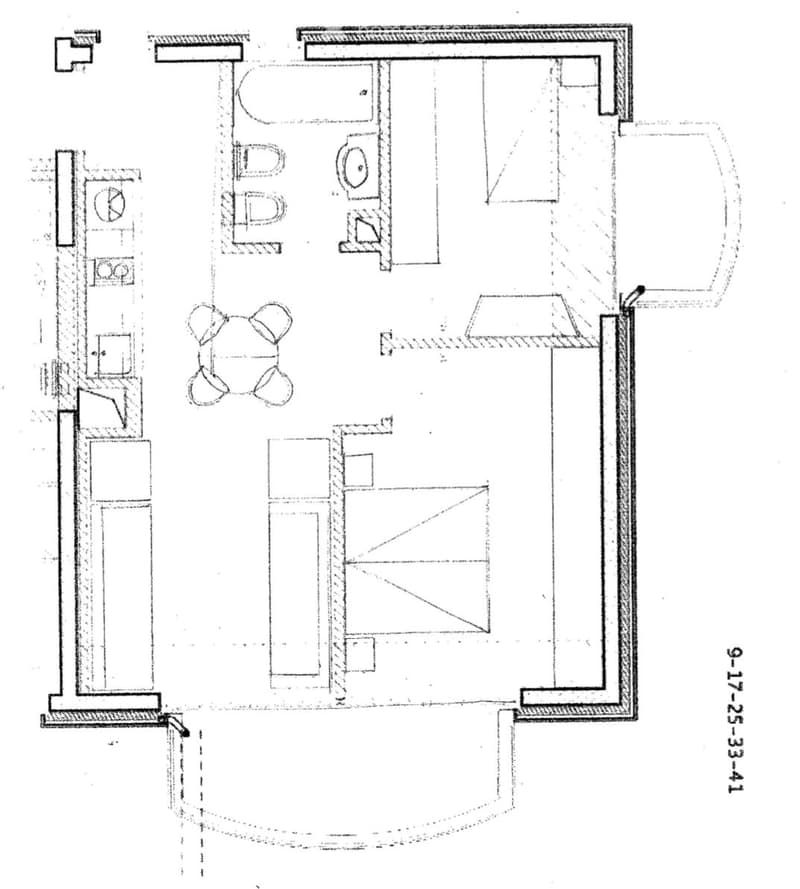 Floor plan of a residential space with a living room, dining area, kitchen, and bedroom.