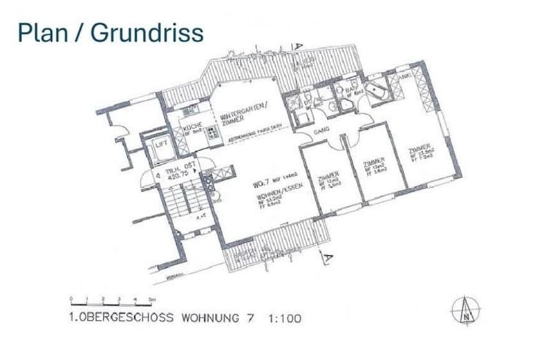 Floor plan of a residential unit on the first upper floor, showing multiple rooms including a kitchen, living room, bedrooms, and bathrooms.