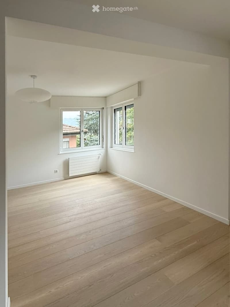 Completely empty room with bare walls and wooden floor. No furniture or equipment.