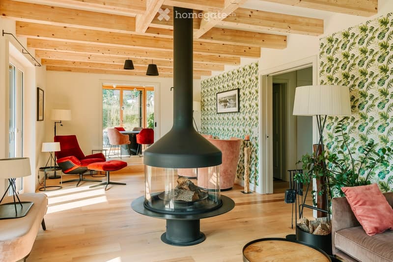 wooden ceiling, large fireplace, open floor, green leaf wallpaper, modern furniture