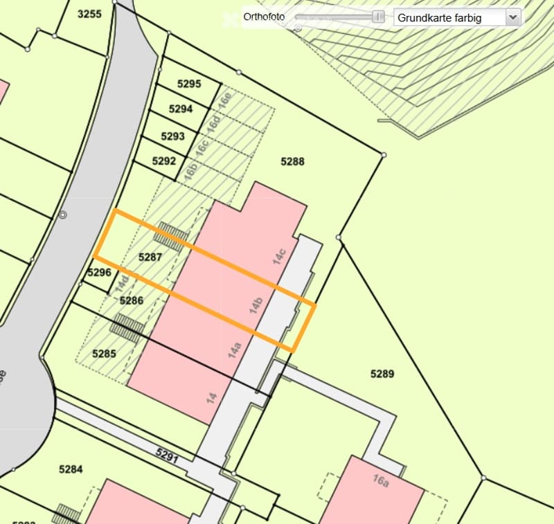 Topographic map showing property boundaries and plot numbers, with highlighted area in orange.