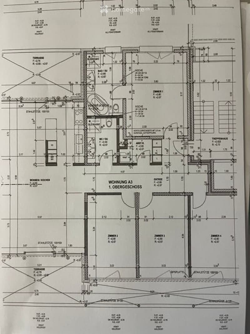 Floor plan of a multi-level residential building, showing layout of rooms, dimensions, and structural details.