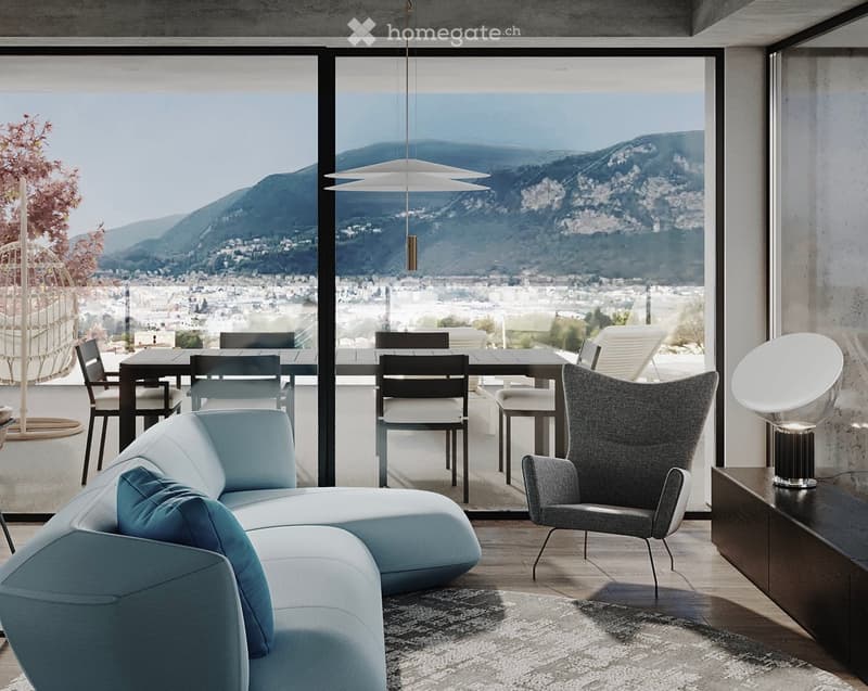 Modern living room with large windows offering a scenic mountain view, featuring a light blue sofa, grey armchair, dining table with chairs, and pendant lighting.