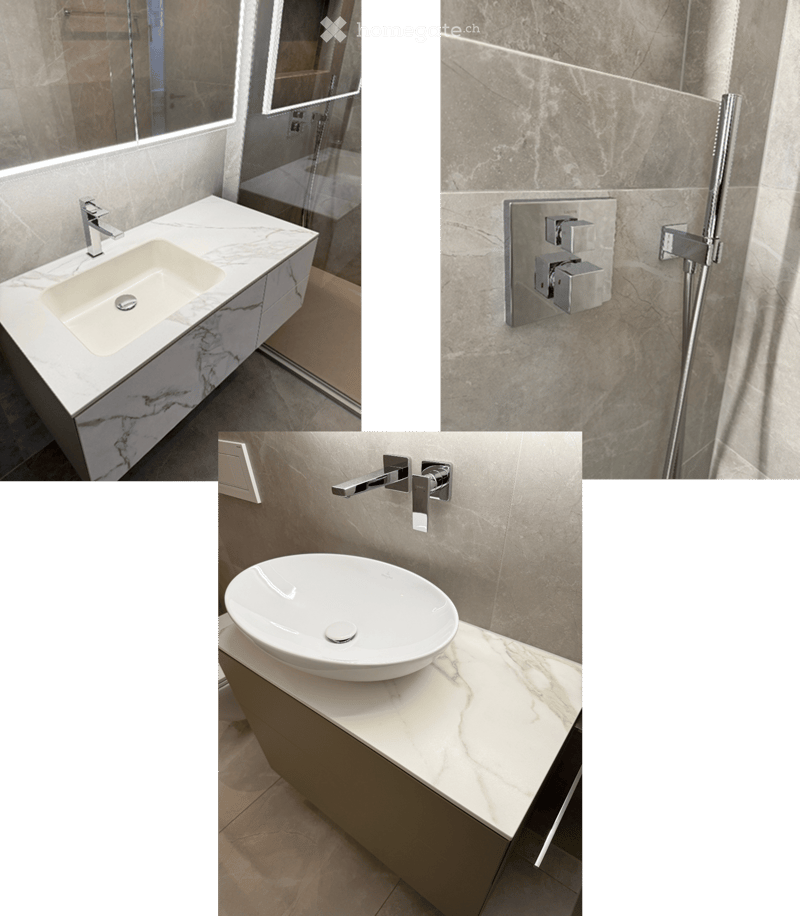 Marble counters, modern fixtures, glass-enclosed shower, stainless steel faucets, green borders
