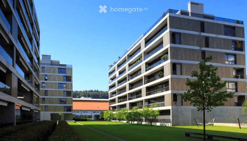 Apartment complex, modern architecture, balconies, green areas, landscaped lawn