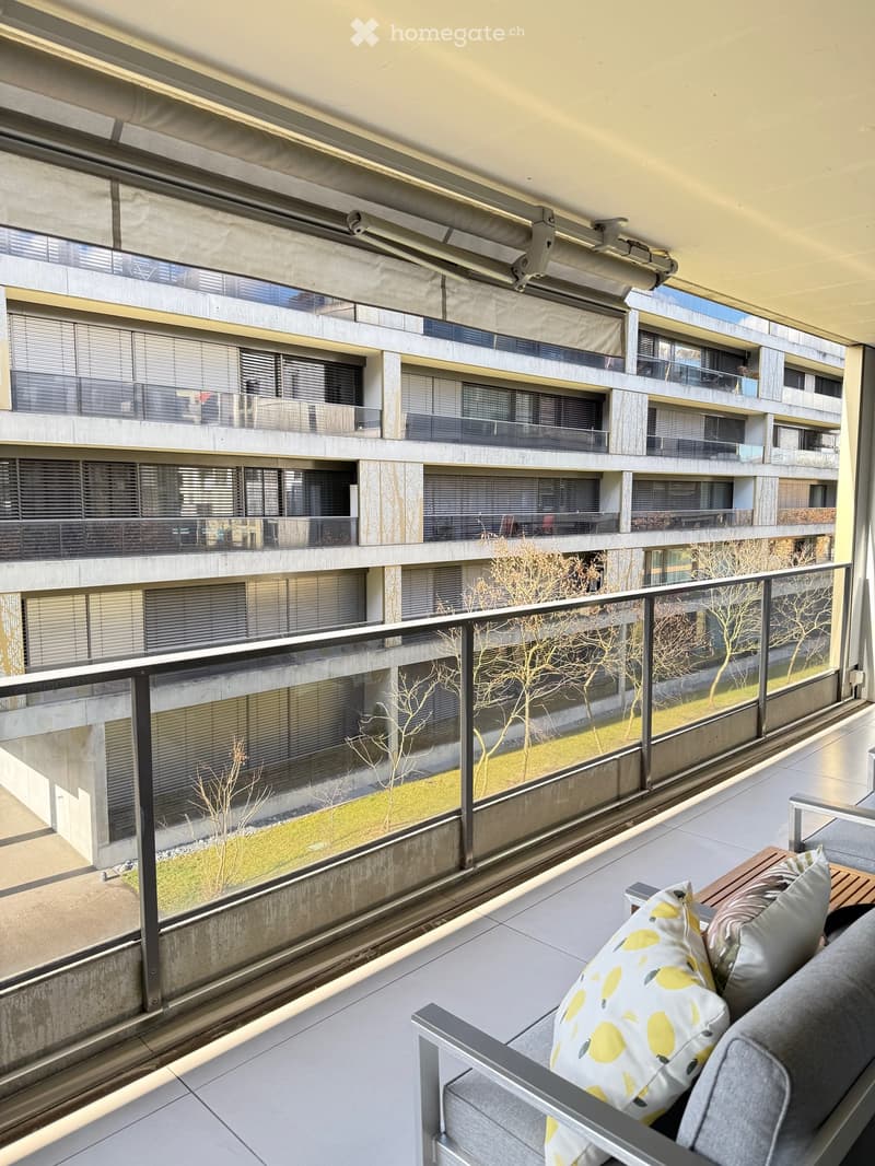 balcony with metal railing, glass doors, sitting furniture, white ceiling