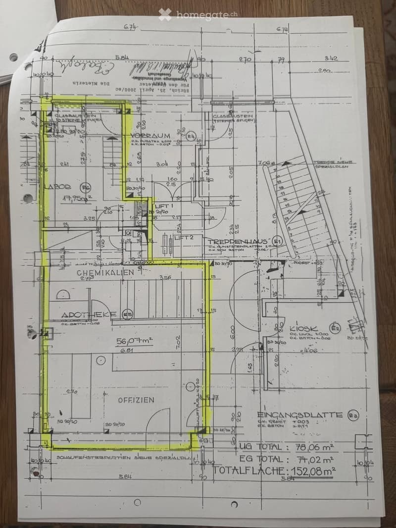 Floor plan of a building showing various rooms including a laboratory, pharmacy, offices, and a staircase. Dimensions and room labels are indicated.
