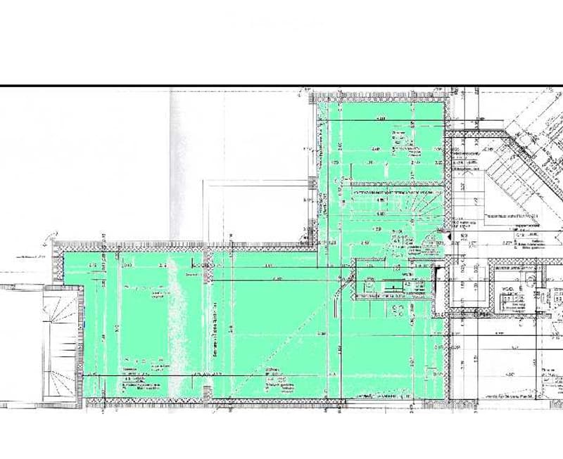 Floor plan of a residential building showing multiple rooms, including living areas, bedrooms, bathrooms, and a kitchen.