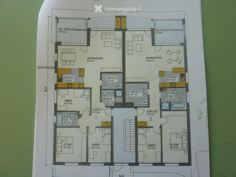 Floor plan of a two-story house with multiple rooms including living rooms, kitchens, bedrooms, bathrooms, and storage areas.
