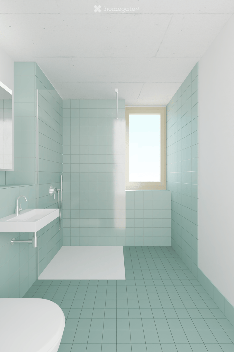 Tiled walls and floor, white shower, white sink, silver fixtures, window, space for toilet