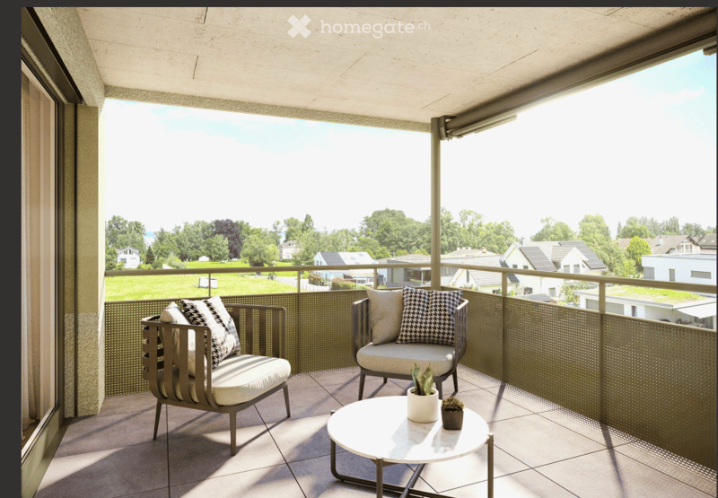 Modern balcony with a view of a green landscape, featuring two chairs, a small table, and potted plants.