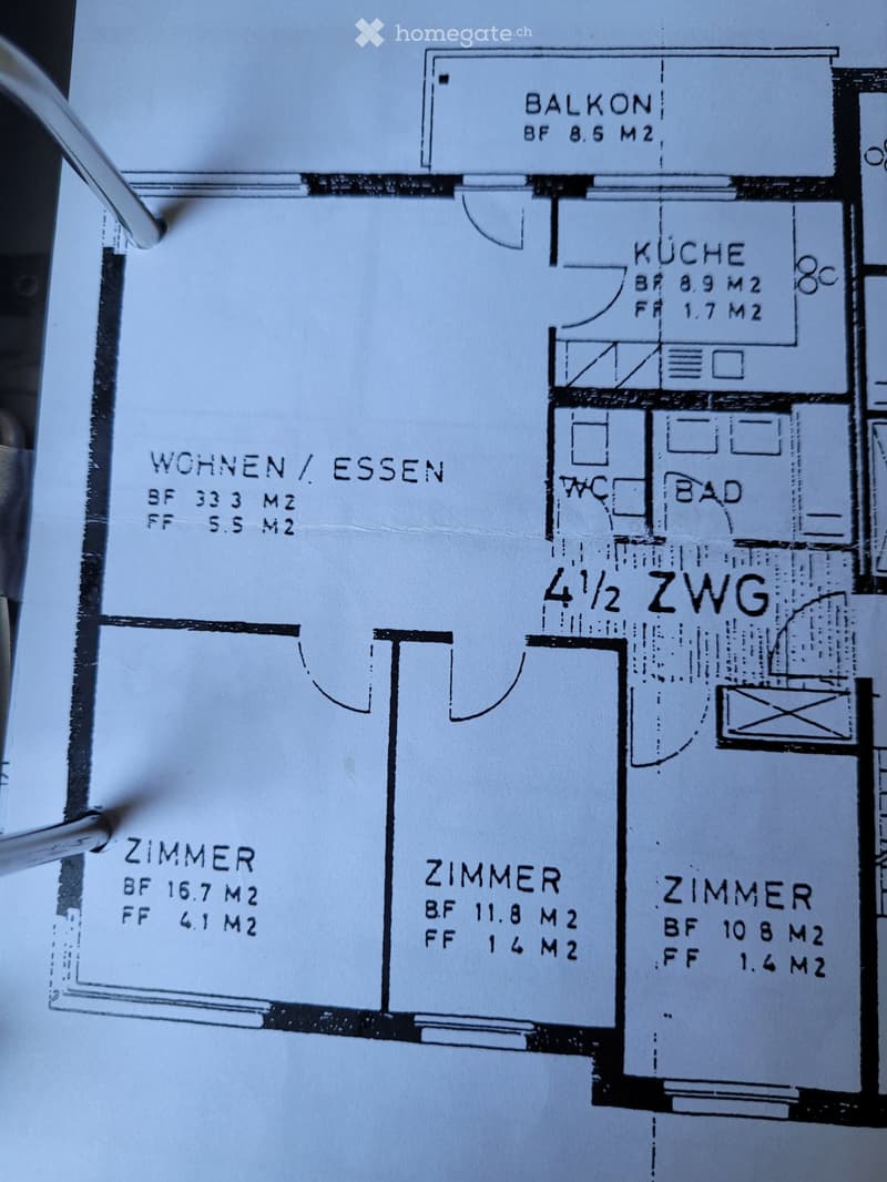 Floor plan of a 4.5-room apartment with labeled rooms including living/dining area, kitchen, bathroom, and three bedrooms, with a balcony.