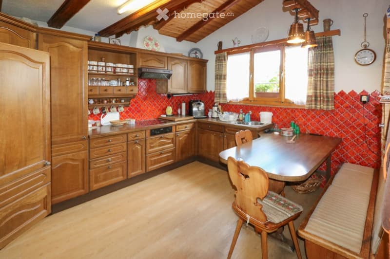 {"type": "Kitchen", "objects": ["wooden cabinets", "wooden dining table", "wooden chairs", "dishwasher", "coffee maker", "cupboard", "cupboard", "cupboard", "cupboard", "cupboard", "cupboard", "cupboard", "cupboard", "cupboard", "cupboard", "cupboard", "c