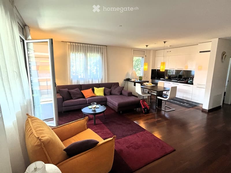 L-shaped sofa, dining table, coffee table, chairs, kitchen, floor lamp, rug