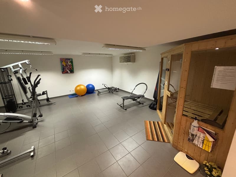 {"output": {    "visible_features": [],    "type": "Room",    "description": "Fitness room with various gym equipments like weight machines, exercise bikes, and yoga mats. A wooden sauna and a rug is present in the room.",    "localized_descriptions":
