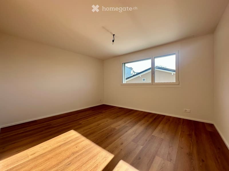 empty room, wooden floor, white walls, large window, power outlet