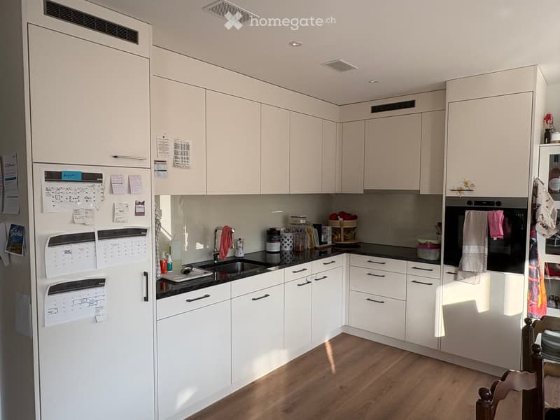 {"type": "Kitchen", "objects": ["refrigerator", "oven", "sink", "faucet", "towel", "calendar", "bottle", "cup", "oven mitt", "oven", "oven", "oven", "oven", "oven", "oven", "oven", "oven", "oven", "oven", "oven", "oven", "oven", "oven", "oven", "oven", "o