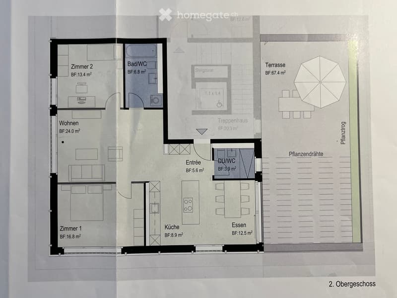 Floor plan of the second floor showing living room, kitchen, dining area, two bedrooms, two bathrooms, entrance, staircase, and terrace.