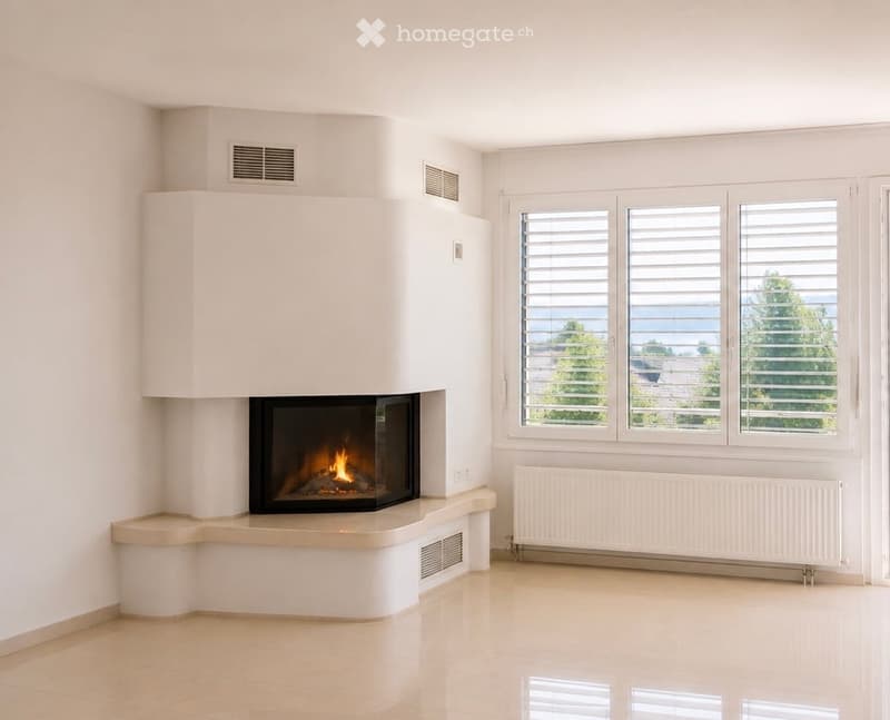 Modern living room with a built-in fireplace, large windows with shutters, and a view of greenery outside.