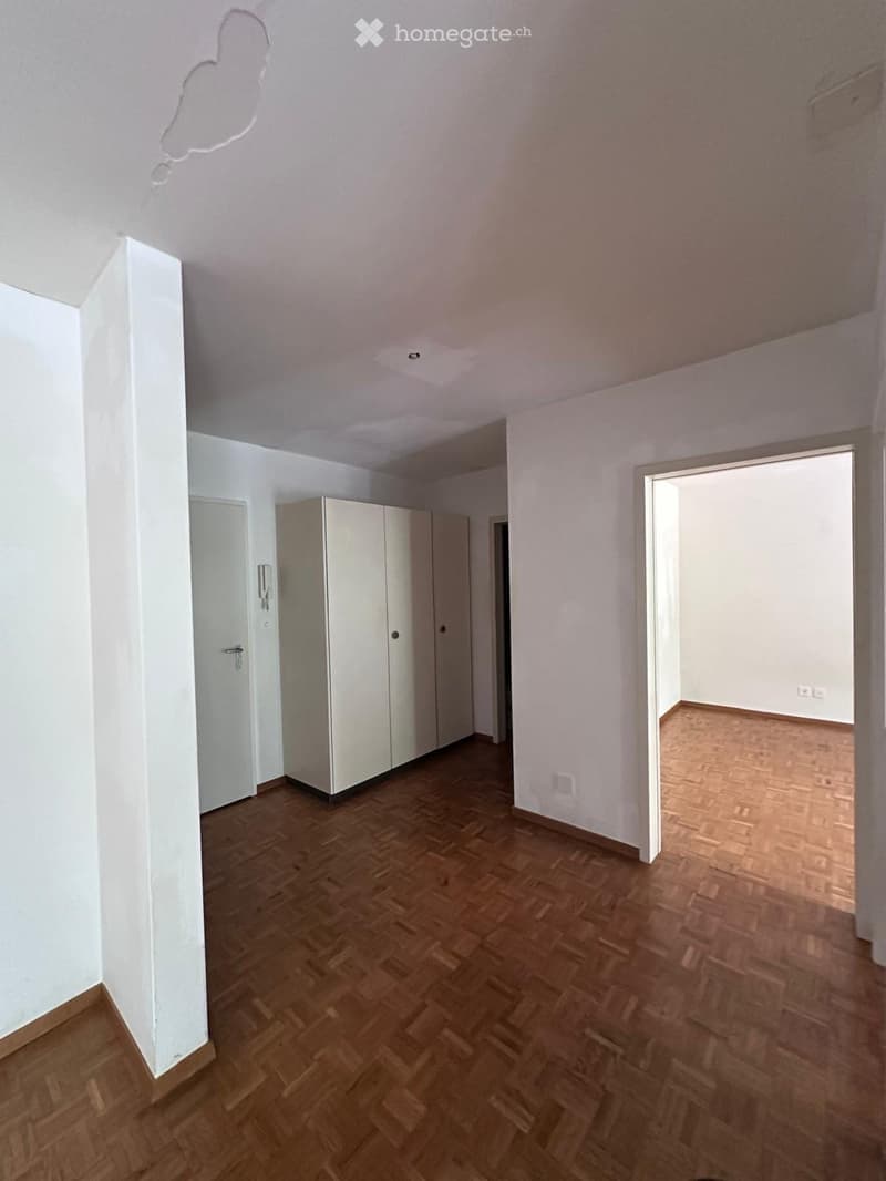 Empty room with wooden flooring, white walls, and a closet. No furniture or equipment visible.