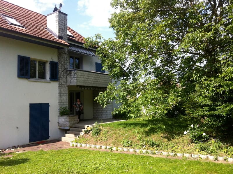 2 story house, red roof, white walls, blue shutters, balcony, garden, tree