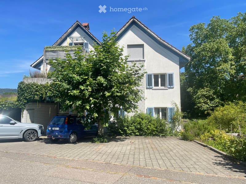 2 story house, white exterior, blue shutters, red roof, garage, 2 cars parked