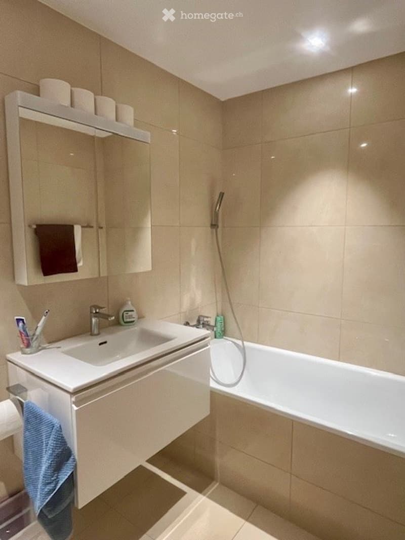 modern bathroom with shower, sink, mirror, bathtub, tiled walls, ceiling light