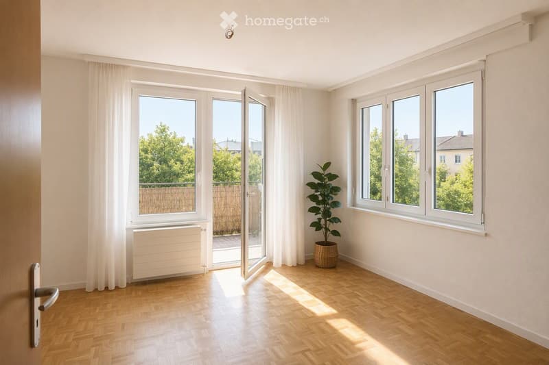 Empty room with wooden flooring, large windows, white walls, and a radiator. A potted plant is placed near the windows, and the room has a sliding glass door leading to an outdoor area.