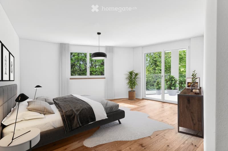 Modern bedroom with a large bed, nightstand, lamps, potted plants, and a side table near the window. The room features wooden flooring, white walls, and large windows with sheer curtains.