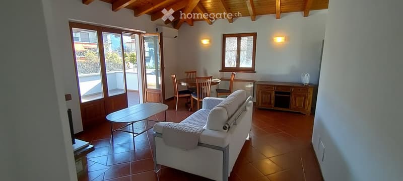 Balcony, dining table and chairs, white couch, cabinet, wood floor