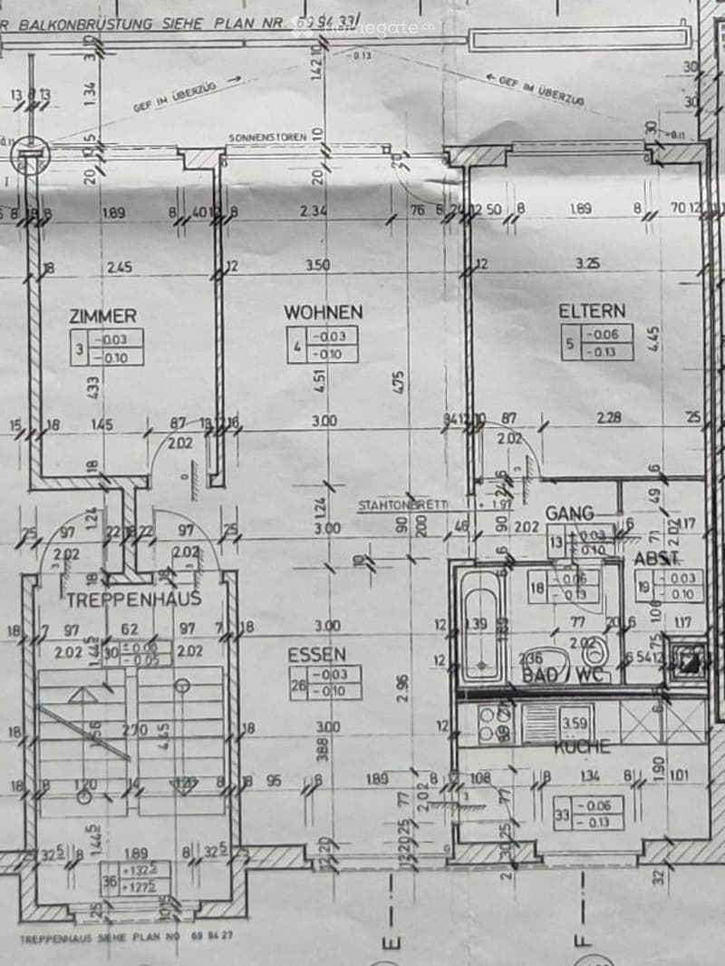 Floor plan of a residential apartment with labeled rooms including living area, bedroom, kitchen, bathroom, staircase, and hallway. Dimensions and room numbers are indicated.