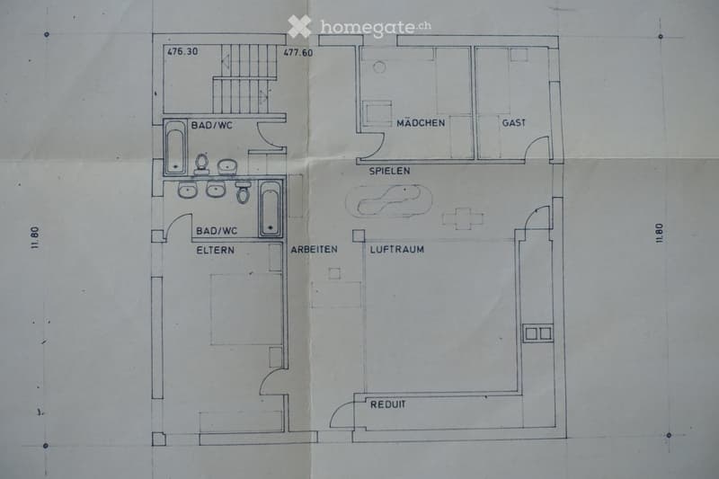 Floor plan of a house with multiple rooms including two bathrooms, a guest room, a children's room, a living space, a workspace, and a study.