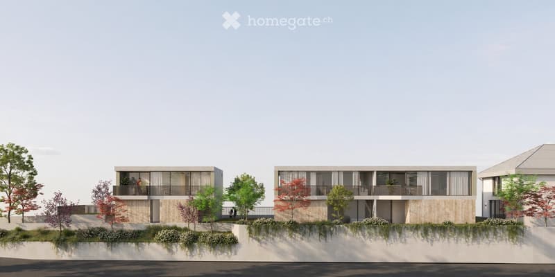 Modern two-story residential building with large windows, balconies, and surrounding greenery.