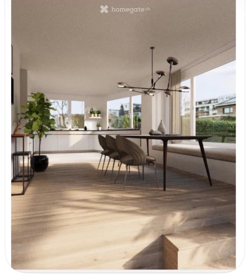 Bright, open-plan living and dining area with modern furniture, large windows, and a sleek chandelier. Includes a dining table with chairs, a sofa, kitchen cabinets, and a potted plant.