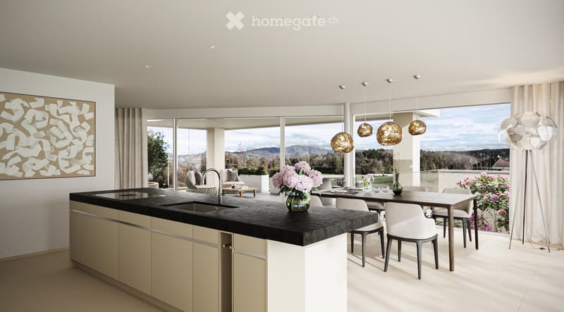 Modern kitchen with a central island, pendant lights, and a dining area with a view of the landscape.