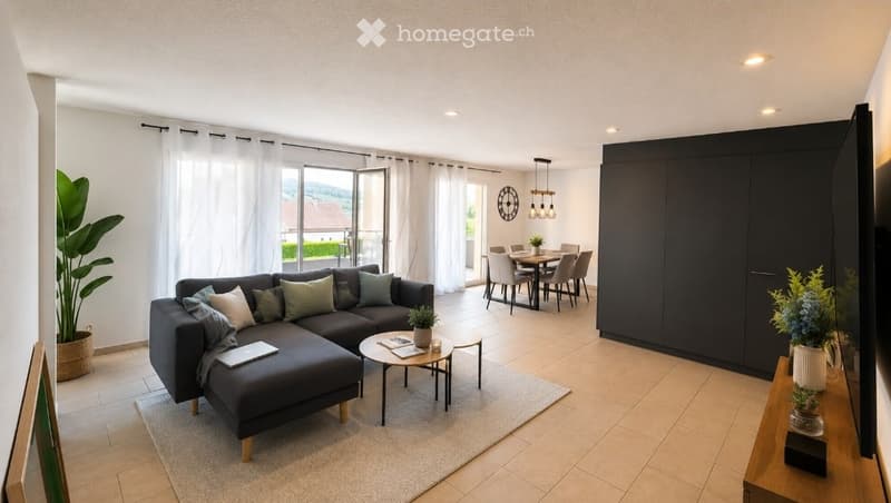 Modern living and dining area with a grey sectional sofa, coffee table, dining table with chairs, large windows, and a tall plant in the corner.