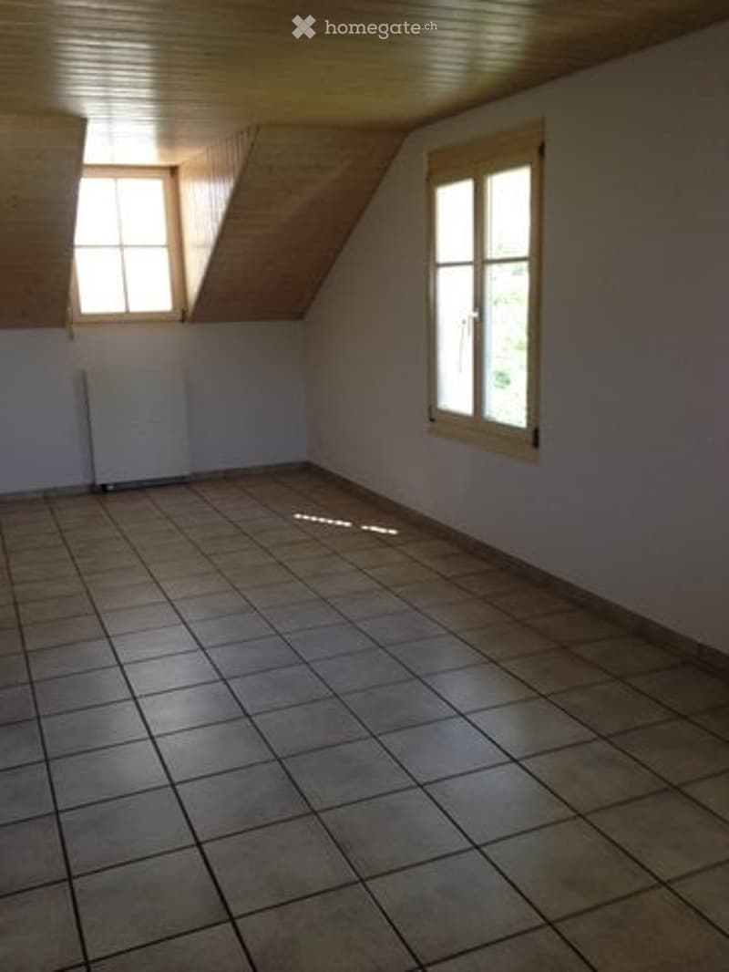empty room, tiled floor, two windows, wooden ceiling