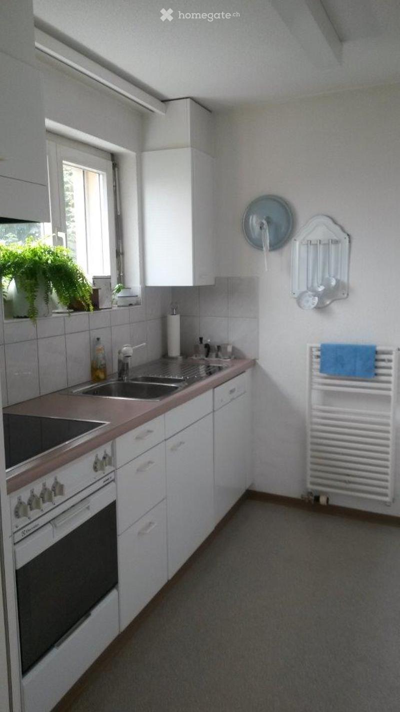 white cabinets, tiled backsplash, dishwasher, sink, stove, natural light from window