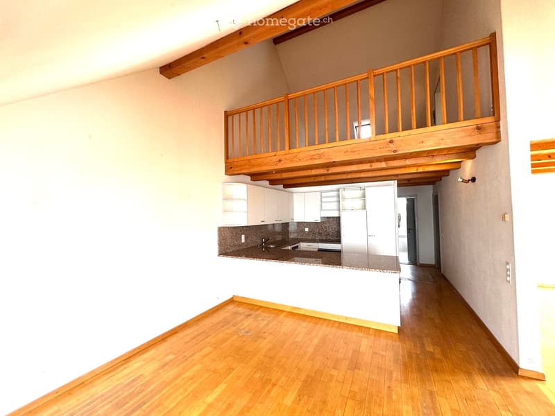 empty room, wooden floor, white walls, wooden balcony, kitchen with granite countertop, sink, faucet, cabinets, refrigerator