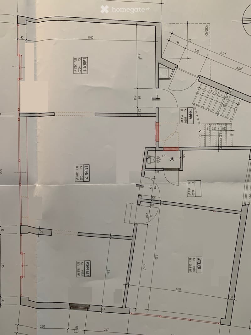 Floor plan showing multiple rooms including a Vorplatz (entrance area), Atelier (studio), Laden1 and Laden 2 (stores), Treppe (stairs), and WC (restroom). Dimensions and labels are provided for each space.
