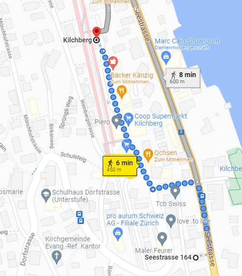 Map showing a walking route through Kilchberg, Zurich, with nearby points of interest including shops, supermarkets, and public transport stops.