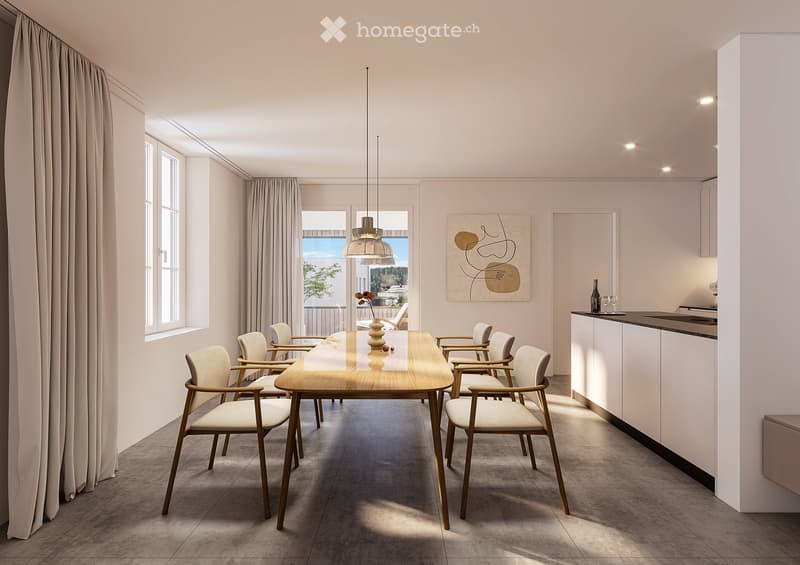 Modern dining area with a wooden dining table, six chairs, pendant light, and a small kitchen area with a counter, bottle, and cup. Large windows offer a view of the balcony and outdoor area.