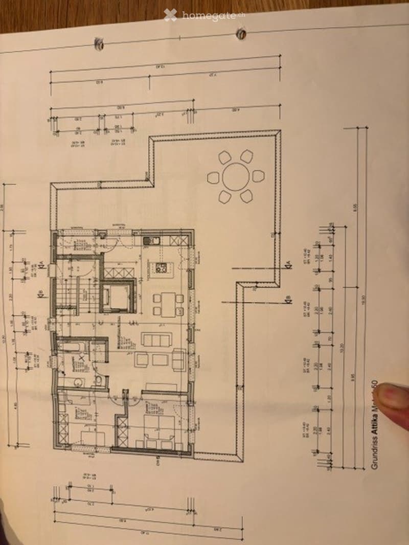 Floor plan of a residential space showing a living room, dining area, kitchen, bedrooms, bathrooms, and a balcony.