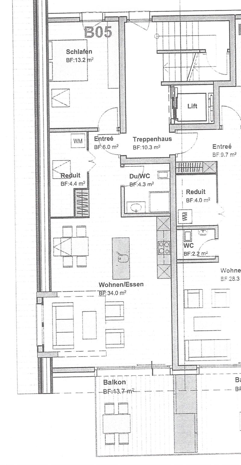 Floor plan showing a layout with a bedroom, living/dining area, balcony, entrance, staircase, and bathrooms.