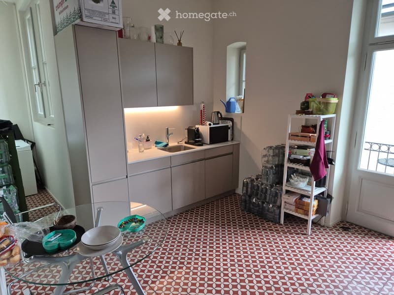 {"type": "Kitchen", "objects": ["refrigerator", "sink", "microwave", "coffee maker", "cupboard", "stool", "table", "cup", "bottle", "faucet", "shelf", "cupboard", "cupboard", "cupboard", "cupboard", "cupboard", "cupboard", "cupboard", "cupboard", "cupboar