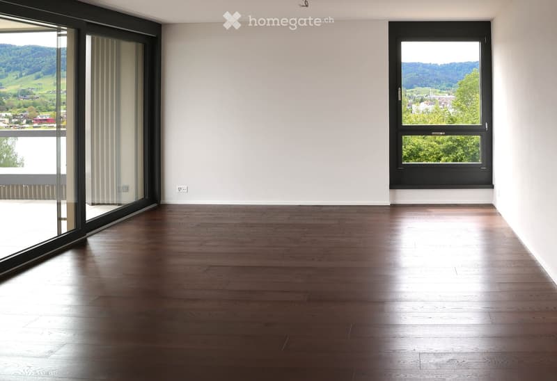 Completely empty room with bare walls and wooden floor. No furniture or equipment.