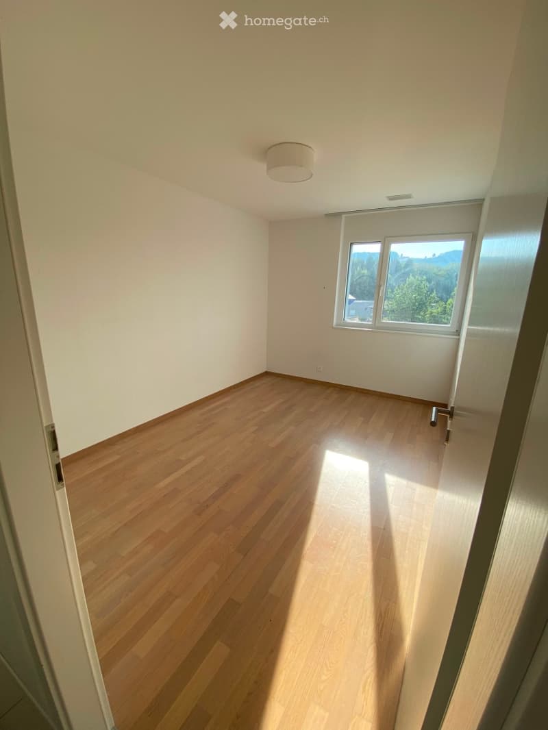 Completely empty room with bare walls and wooden floor. No furniture or equipment.